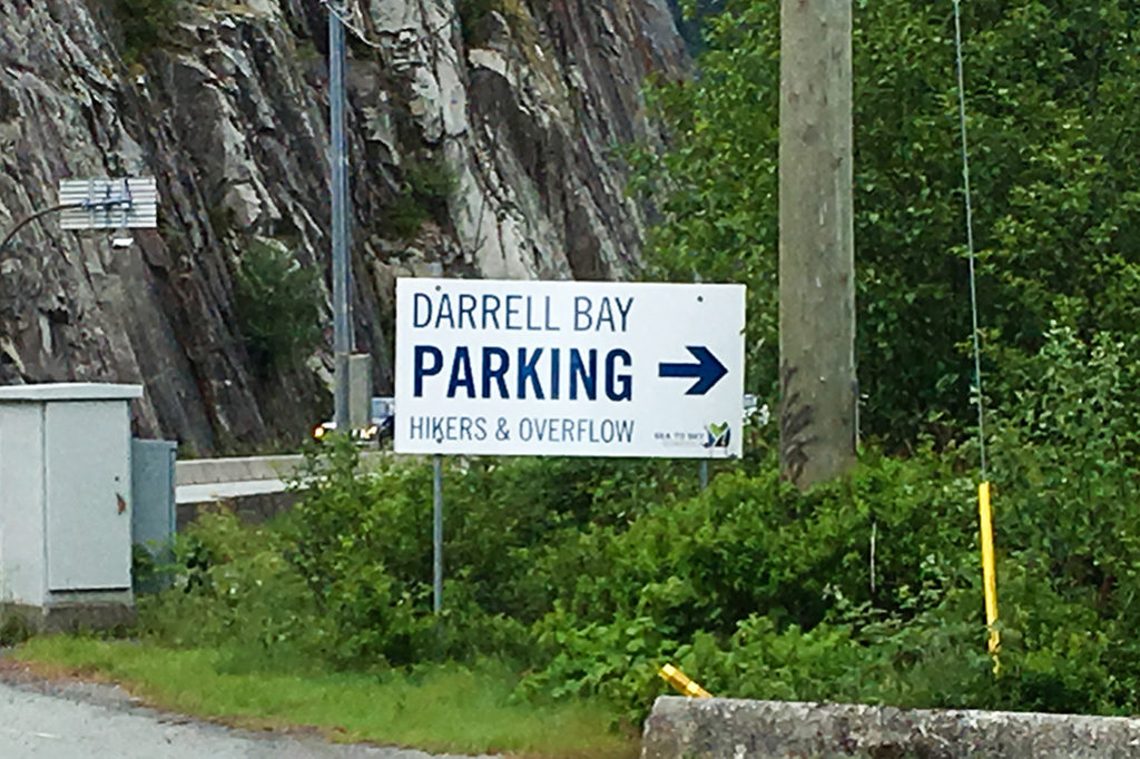 Sign indicating the Darrell Bay parking area for the Sea to Summit Trail near Squamish, BC